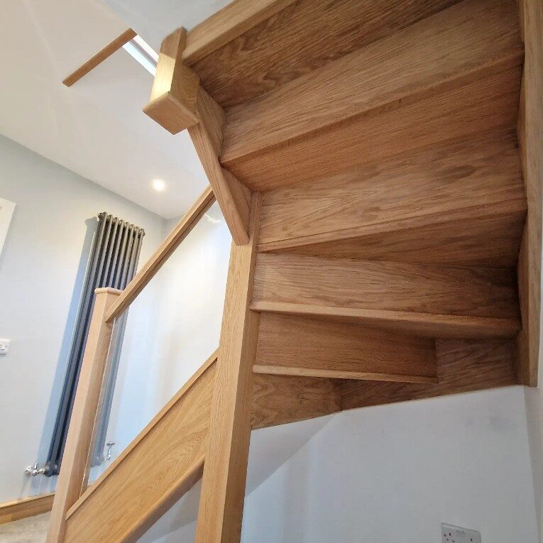 Oak staircase cladding renovation with new oak treads, risers and strings