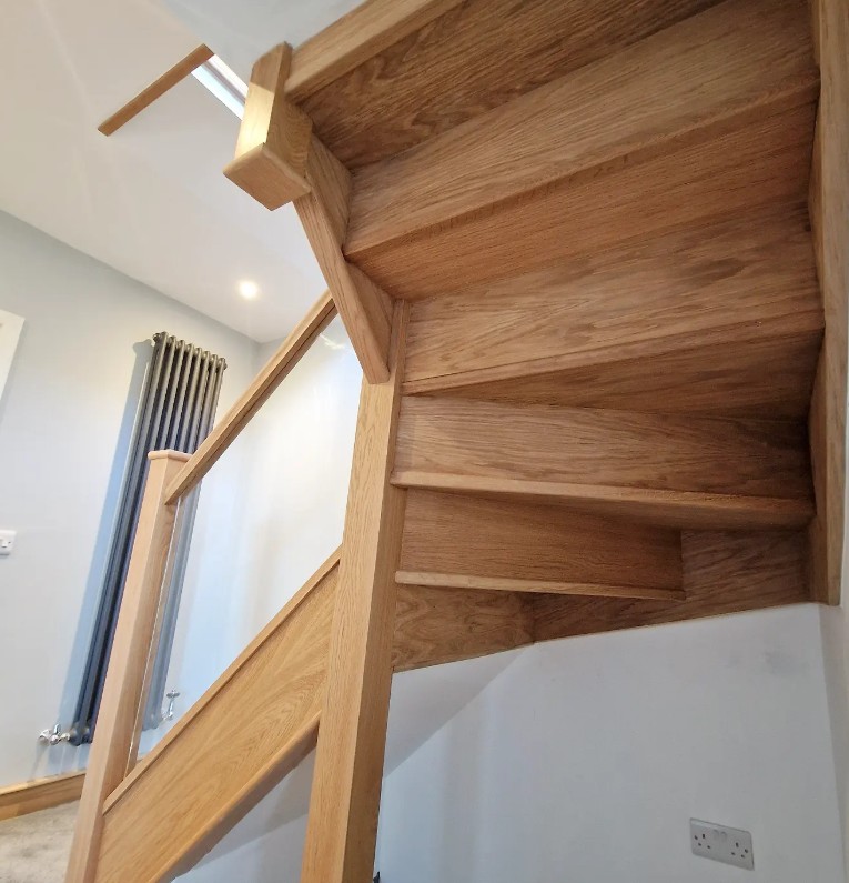 Oak staircase cladding renovation with new oak treads, risers and strings