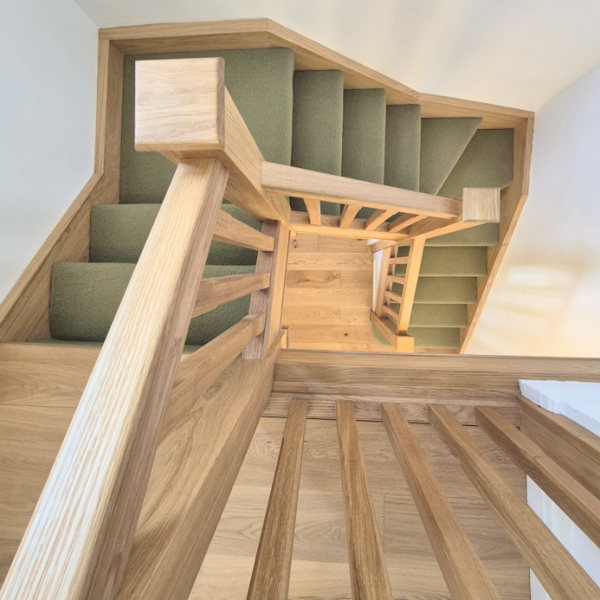 Oak staircase renovation completed in Didsbury, Manchester with solid oak handrails, newel posts and square spindles.