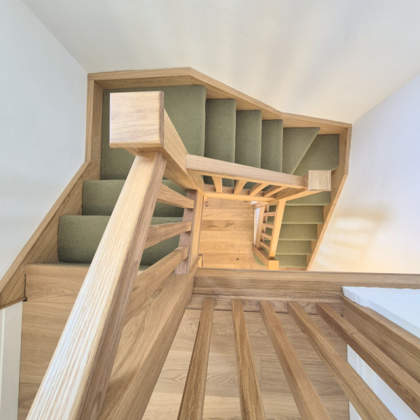 Oak staircase renovation completed in Didsbury, Manchester with solid oak handrails, newel posts and square spindles.